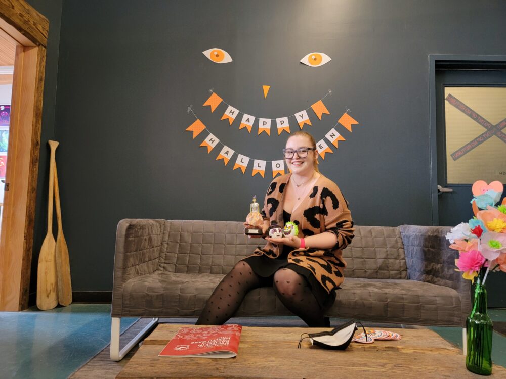 Kali posing with pumpkin and trophy