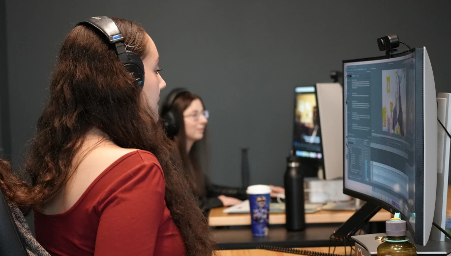 People editing video at their desks