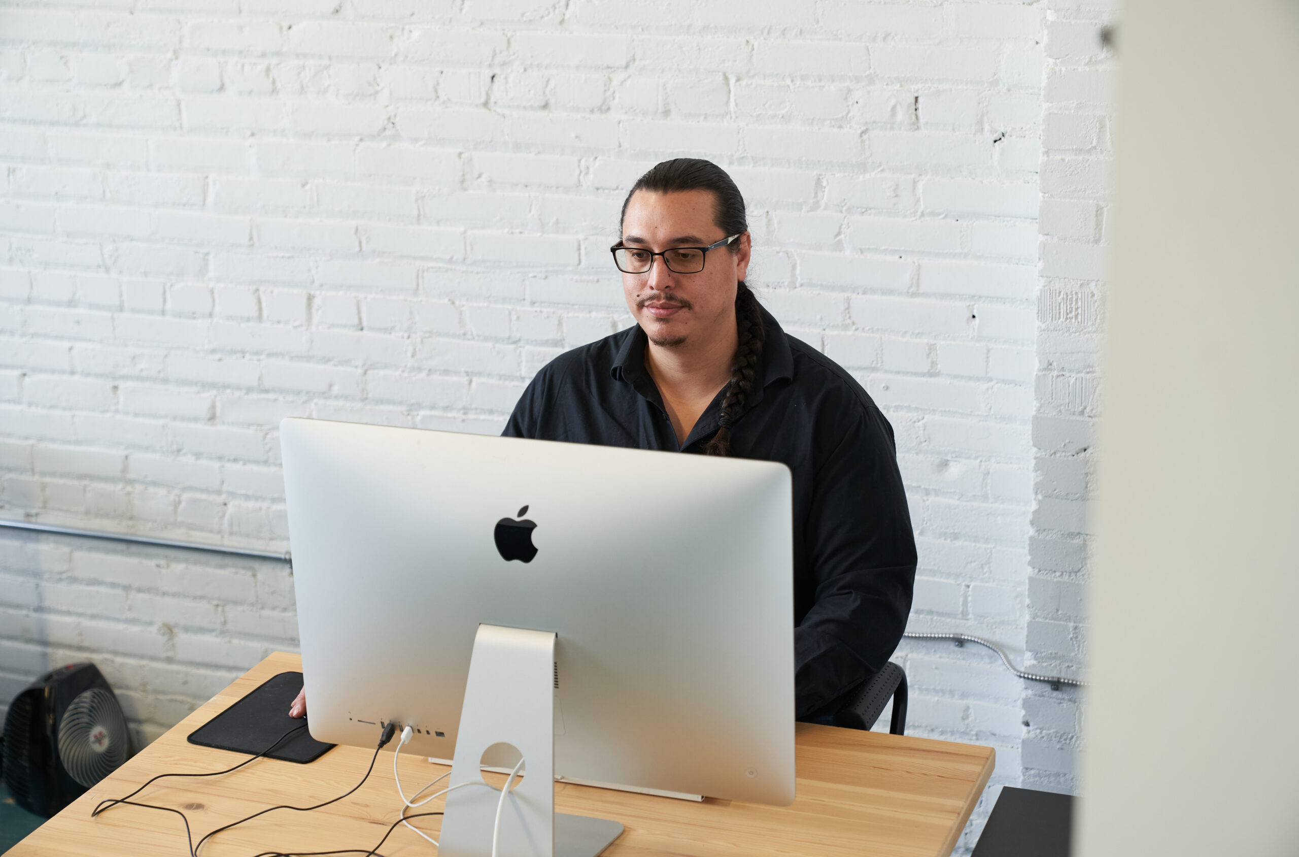 man sitting at desk