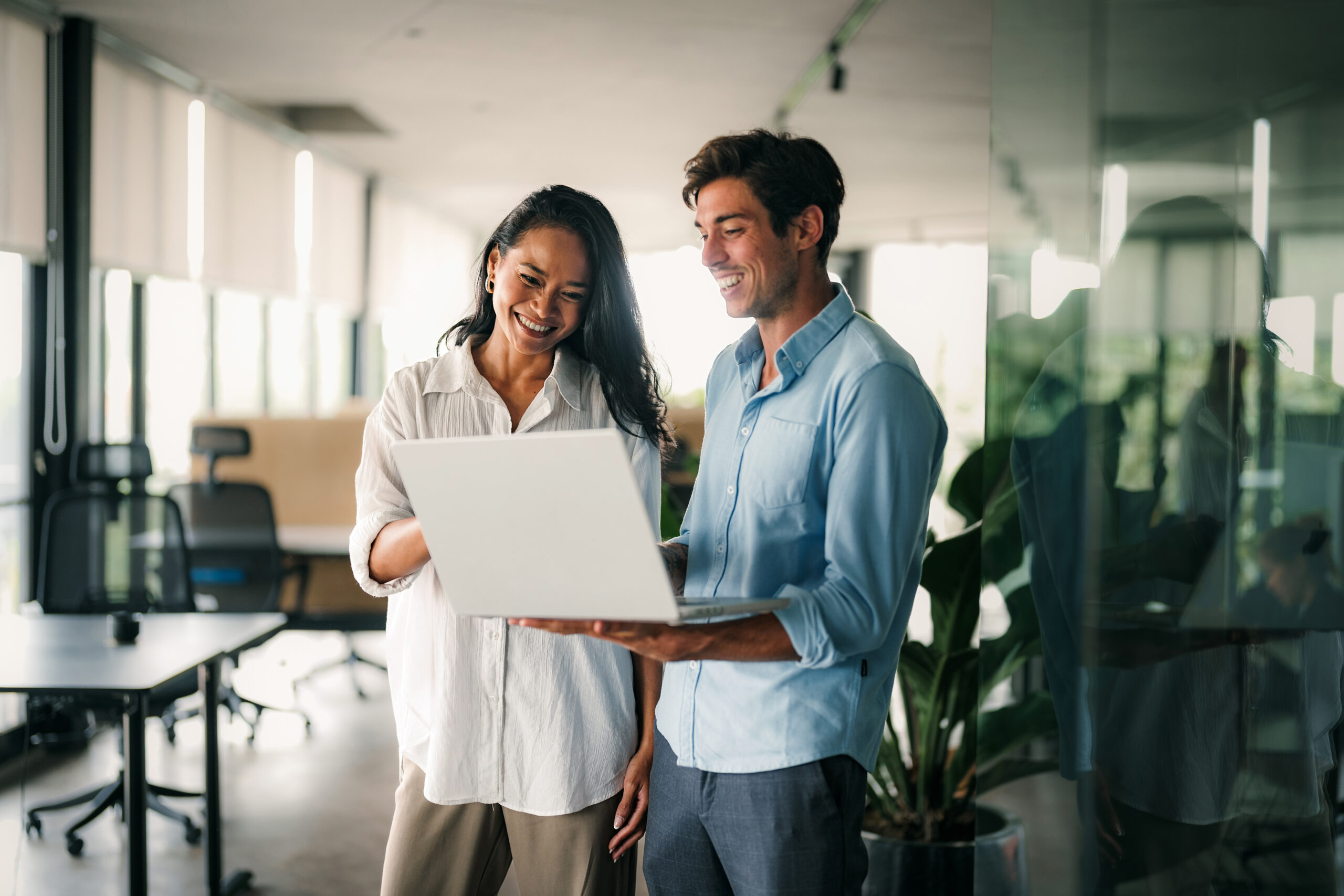 two people looking at laptop