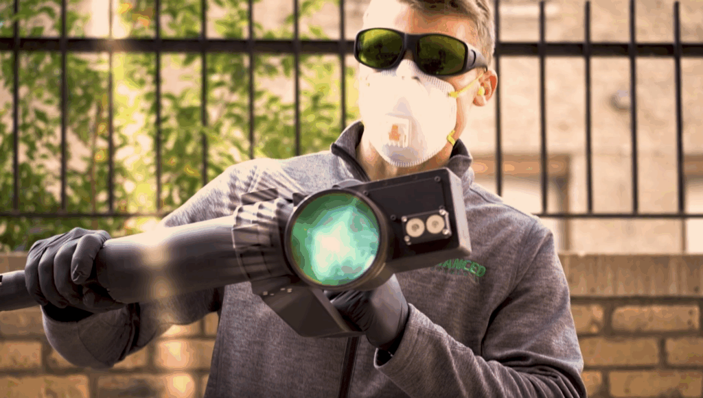 Man using laser technology for Advanced Environmental.